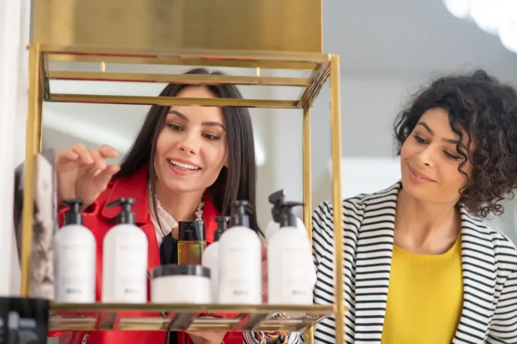 Two ladies shopping for hair products.